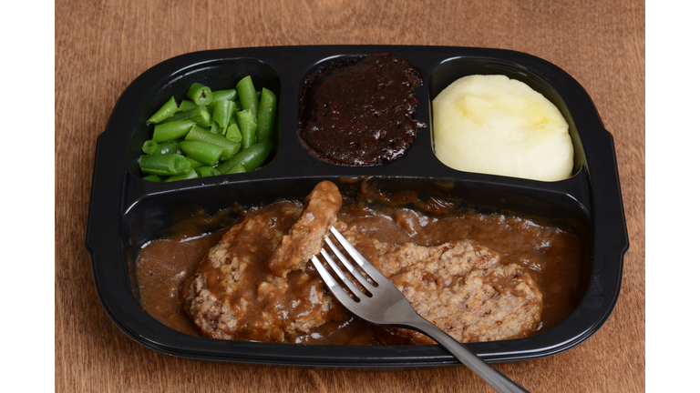 salisbury steak tv dinner with a fork