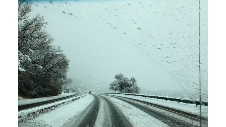 Driving Down The Mountain Road In Utah Snowstorm