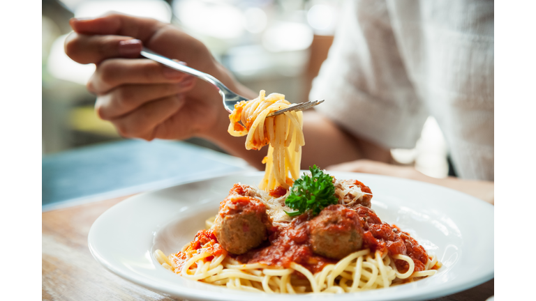 woman eating spaghetti