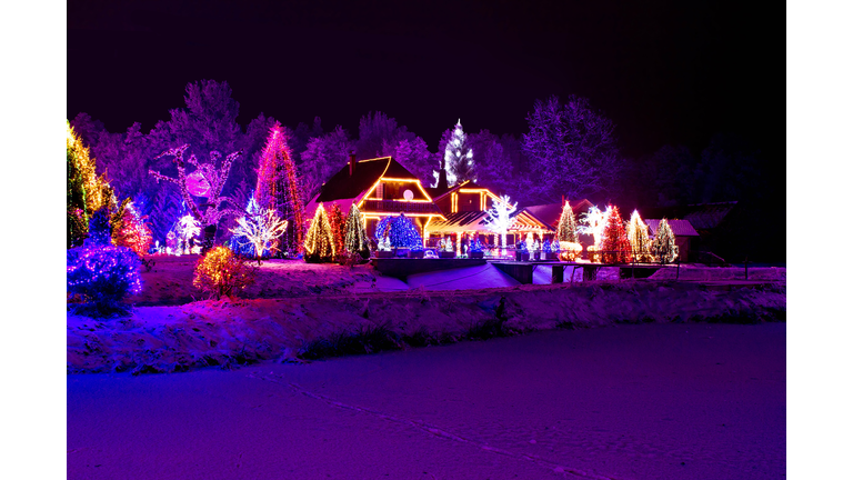 Christmas fantasy - park, forest & lodge in xmas lights