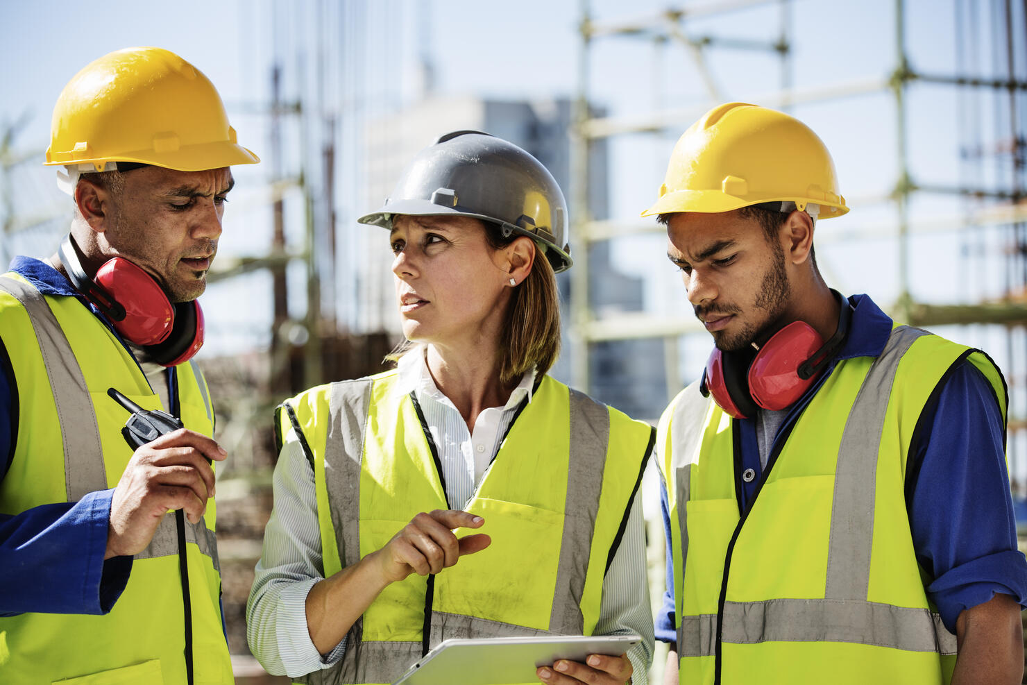 Architects using digital tablet at site