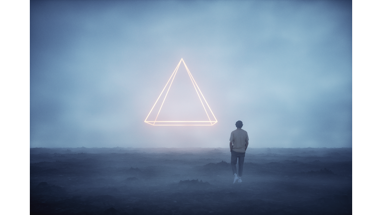 Mysterious pyramid shaped object and man walking