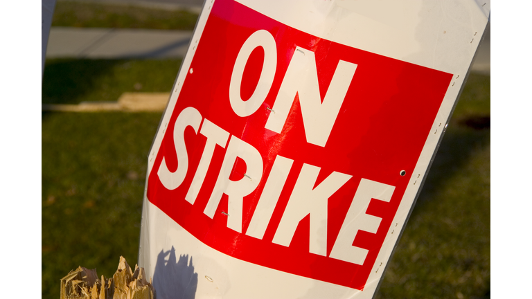 On a Strike sign in red and white poster