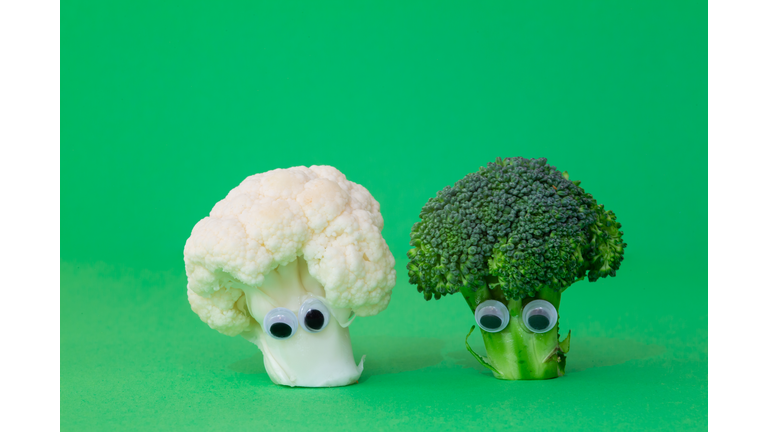 Cauliflower and broccoli with googly eyes