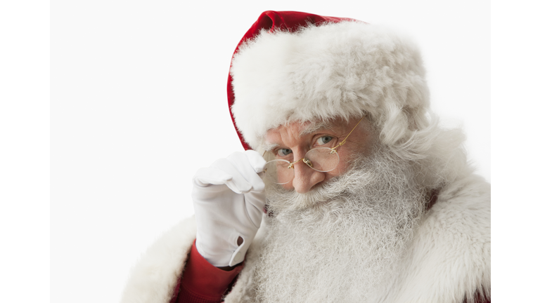 Close up of Santa claus touching his eye glasses