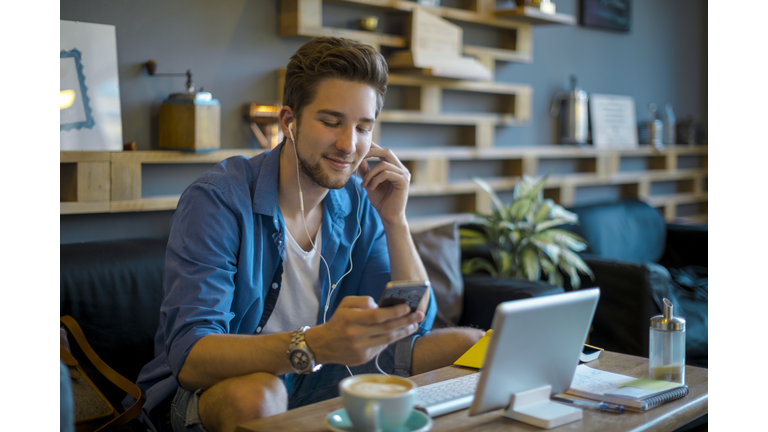 Young man working at home office