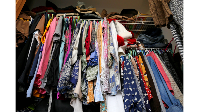 Messy Women's Closet Filled with Colorful Clothes