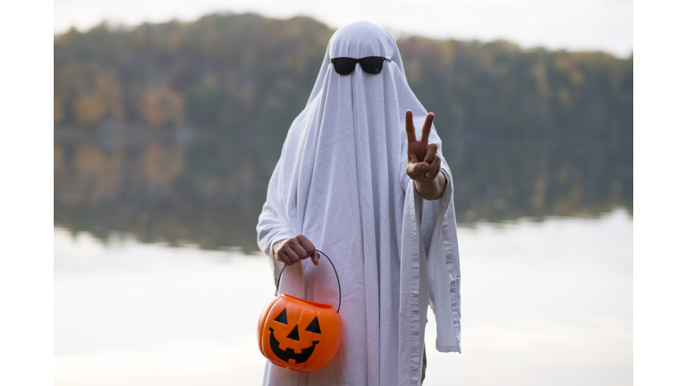 Person in Ghost Costume making Peace Sign