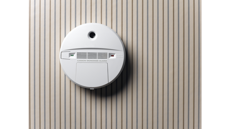 smoke detector and carbon monoxide alarm mounted on wall