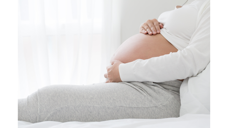 Strain of abdominal muscles during pregnancy, Preterm labor and pregnant women health concept