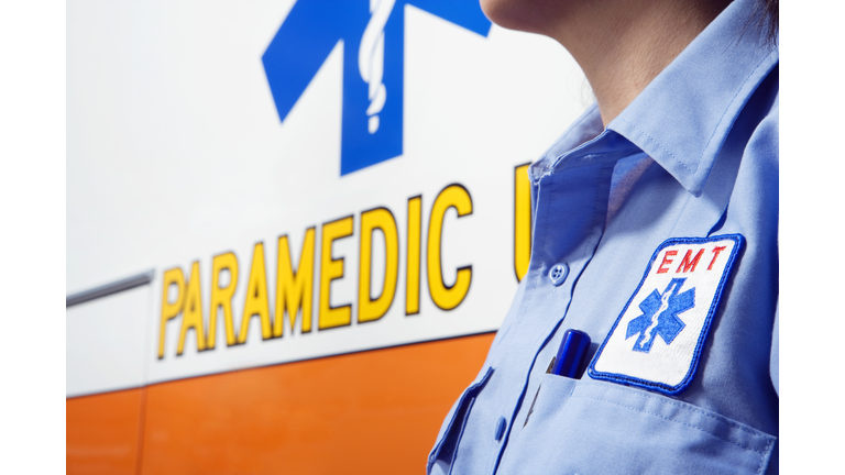 Close up of paramedic next to ambulance