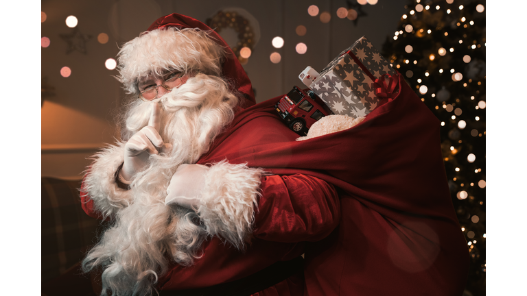 Santa Claus with finger on the lips