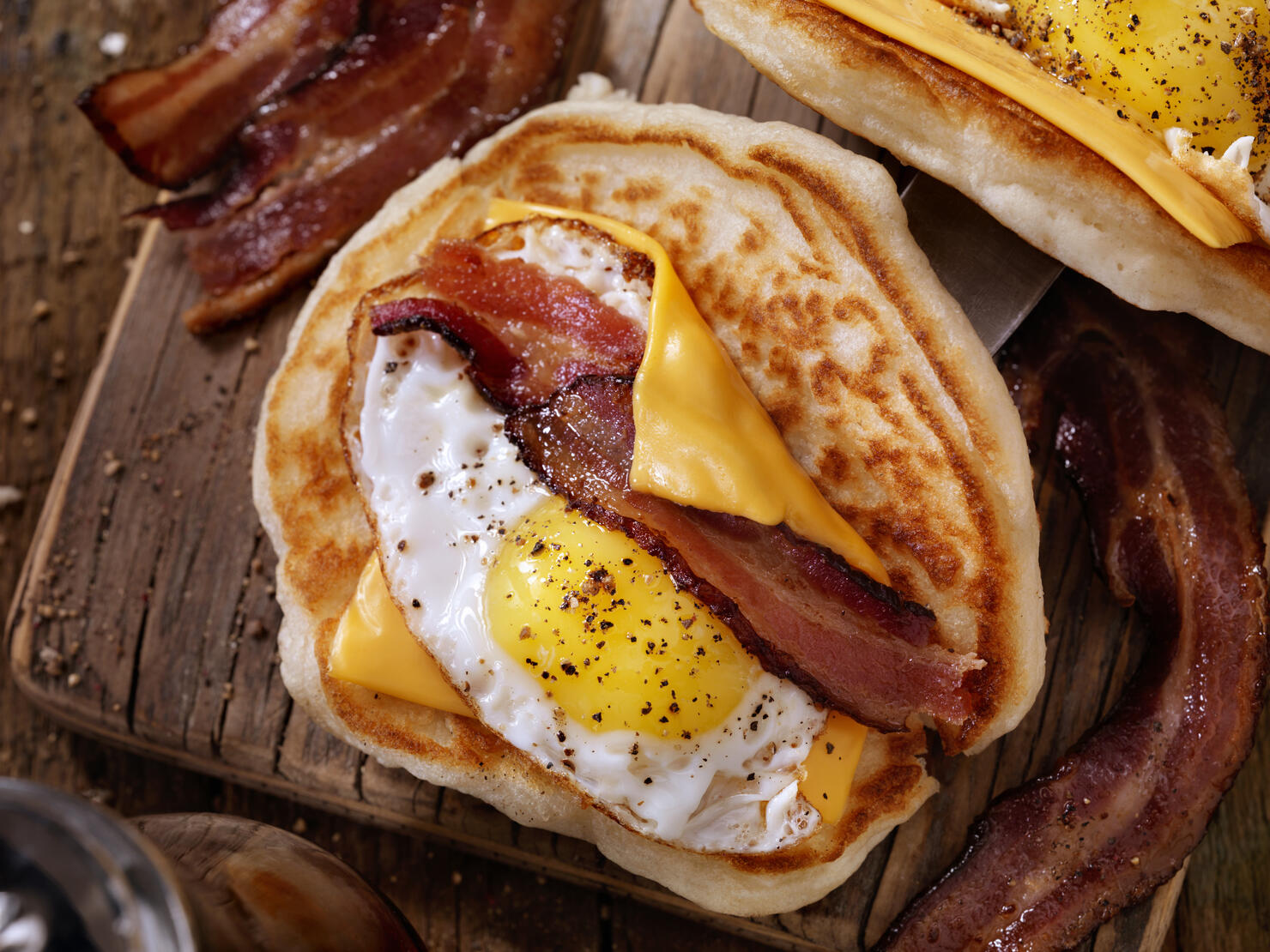 Pancake Breakfast Taco with Suny side up Eggs, Bacon, Cheese