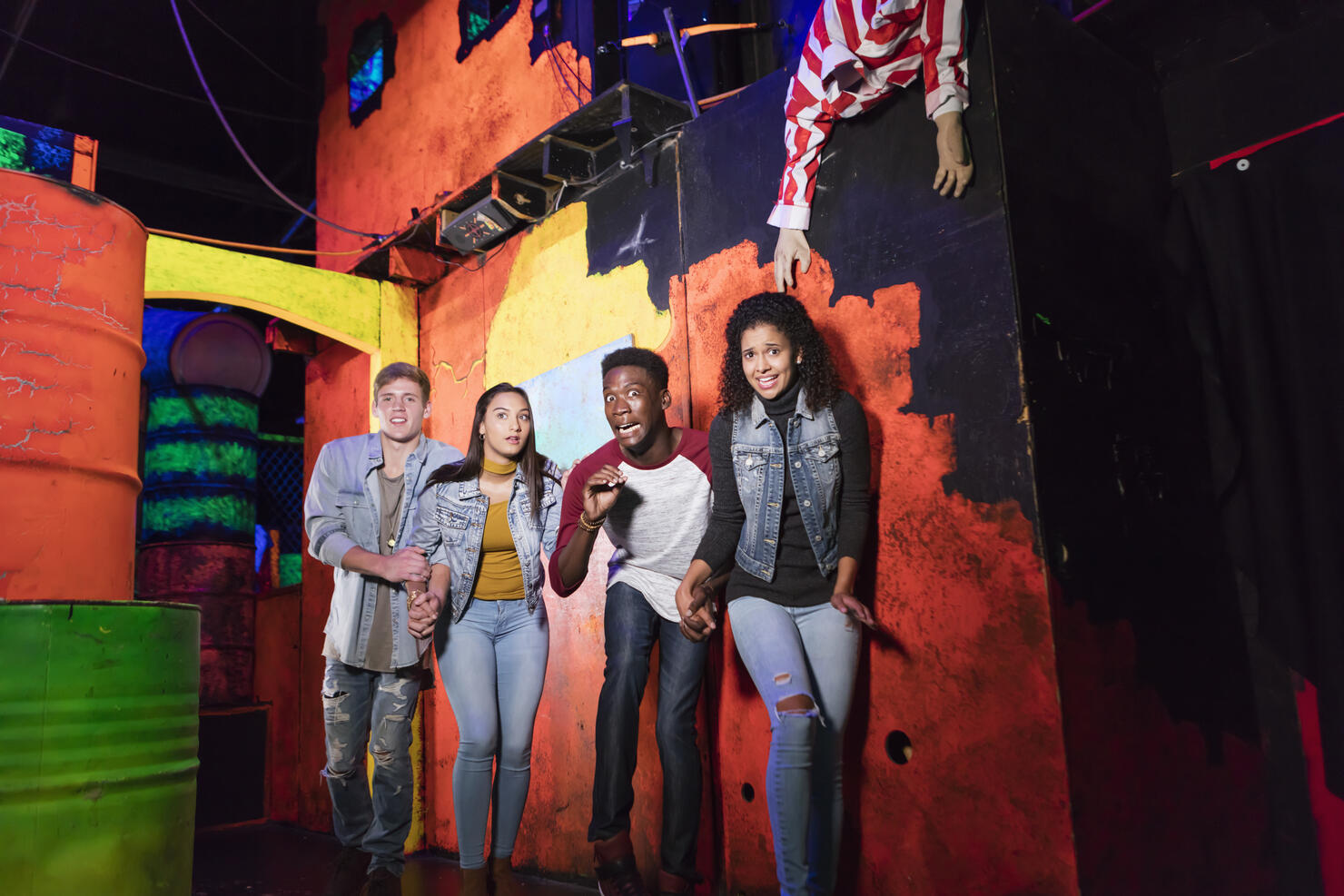Multi-ethnic group of young adults in haunted house