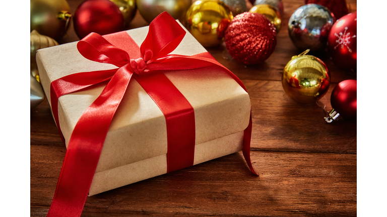 Christmas present on rustic wooden table with copy space