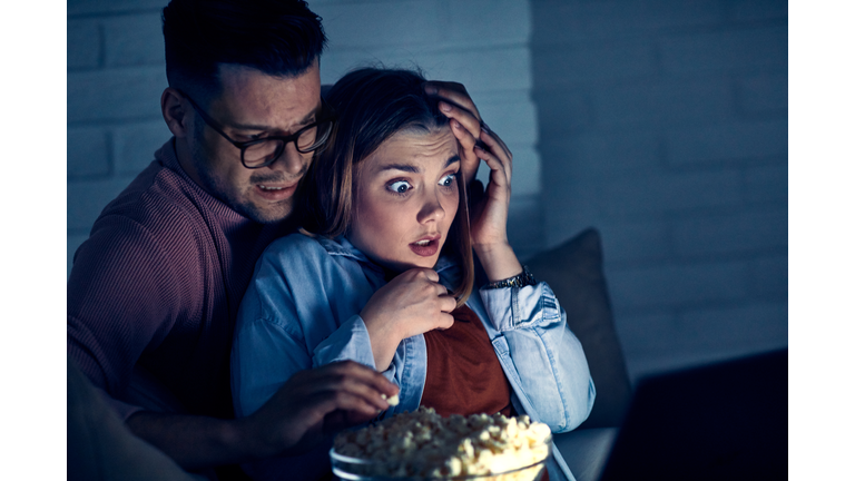 couple movie night horror laptop popcorn love watching entertainment tv film scared scary spooky afraid