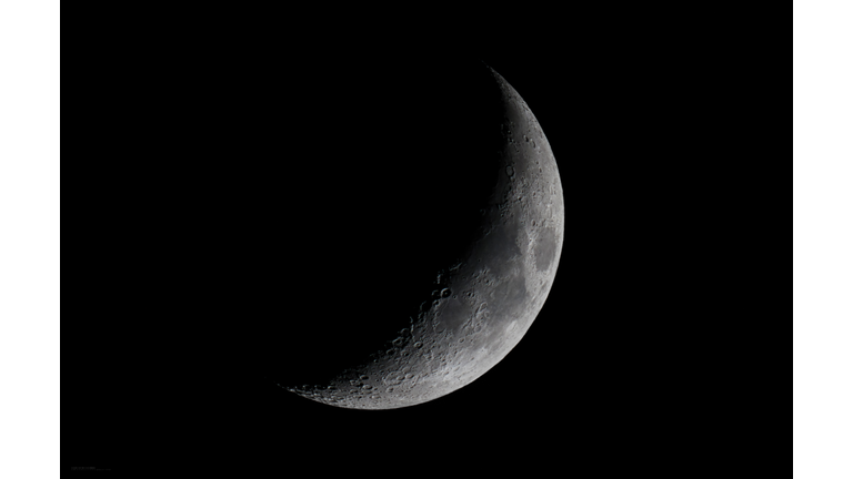 Low angle view of moon against clear sky at night