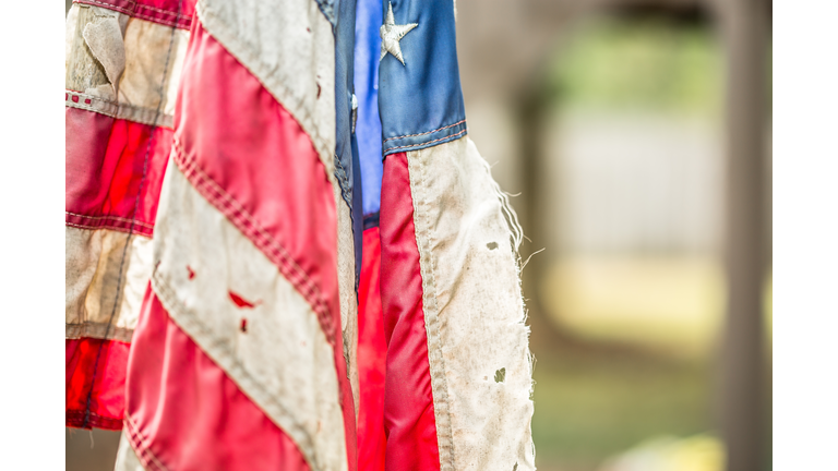 Close-Up Of Tattered American Flag Outdoors