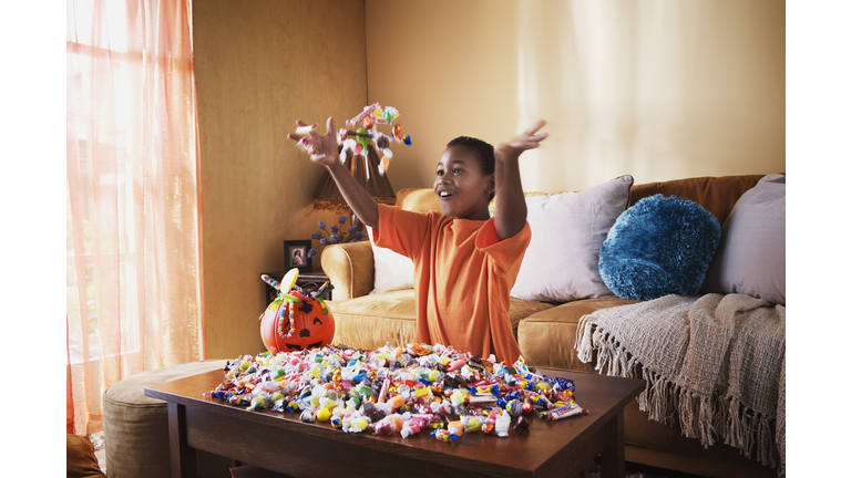 Excited boy with Halloween candy