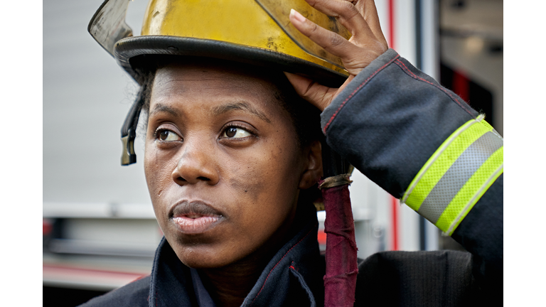 Candid Close-Up of Black Female Firefighter and Helmet