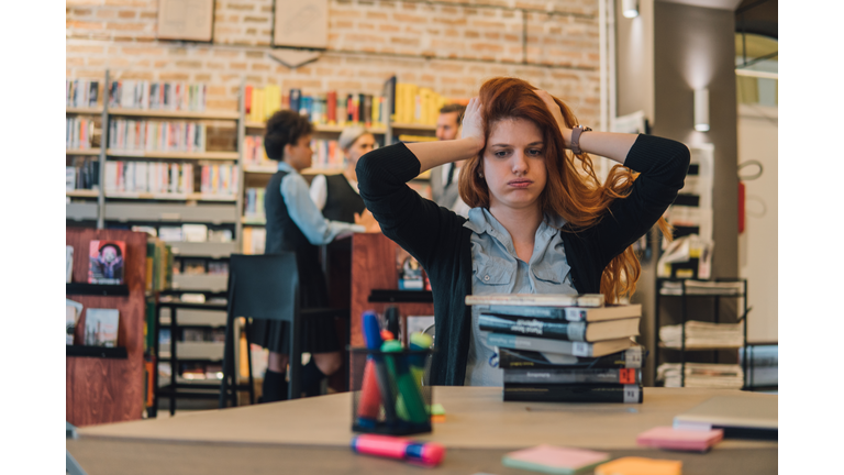 Nervous student in library