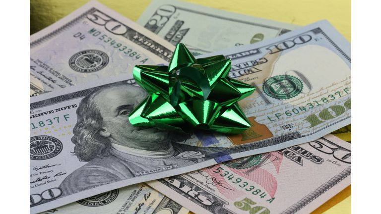 Gift bow decorating a gift of money