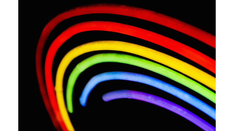 Close-up of a neon illuminating gay pride symbol