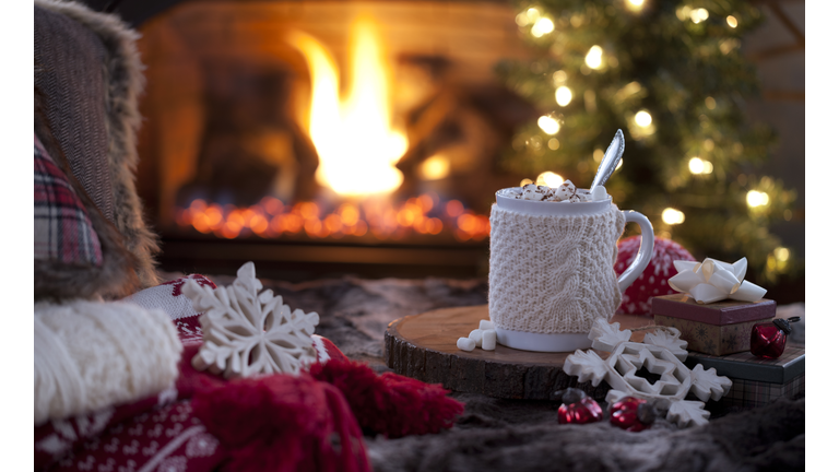 Christmas cozy hot chocolate in front of the fireplace