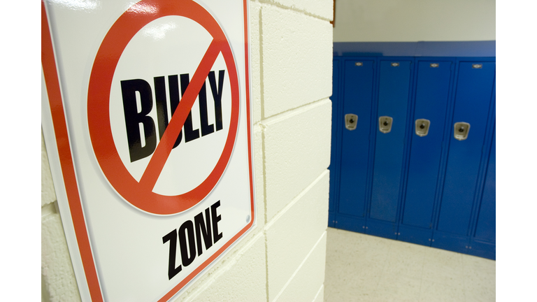 No Bullying Sign Located in School Hallway with Lockers