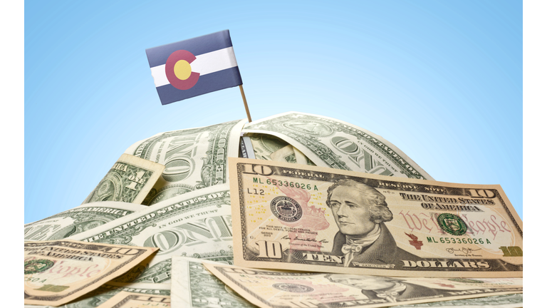 Flag of Colorado sticking in american banknotes.(series)
