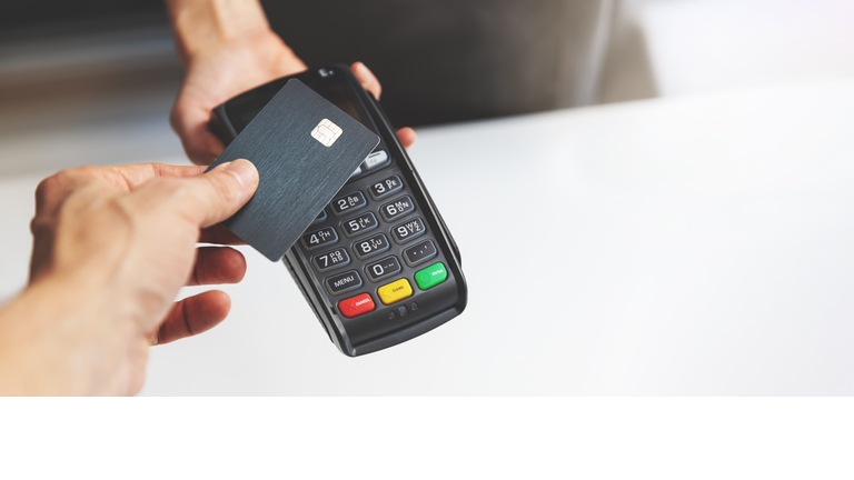 nfc contactless payment by credit card and pos terminal. copy space