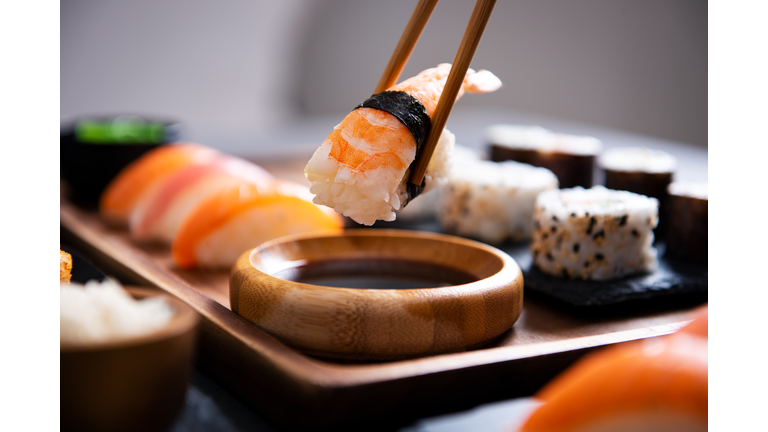Chopstick with nigiri sushi piece
