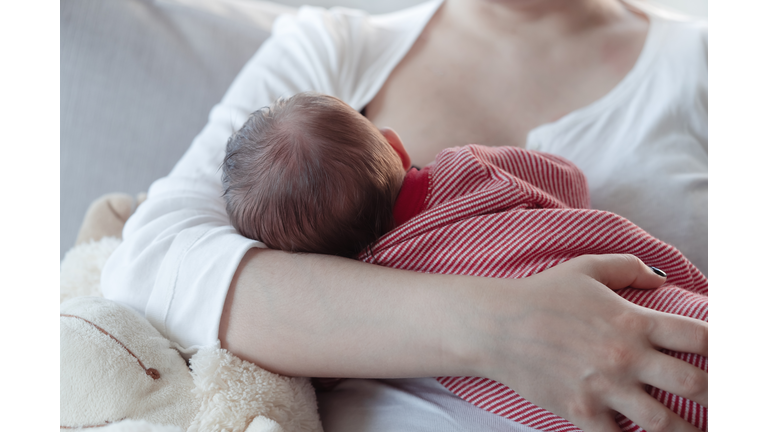 Mom breastfeeding a baby boy