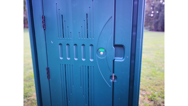 Porta potty in a field