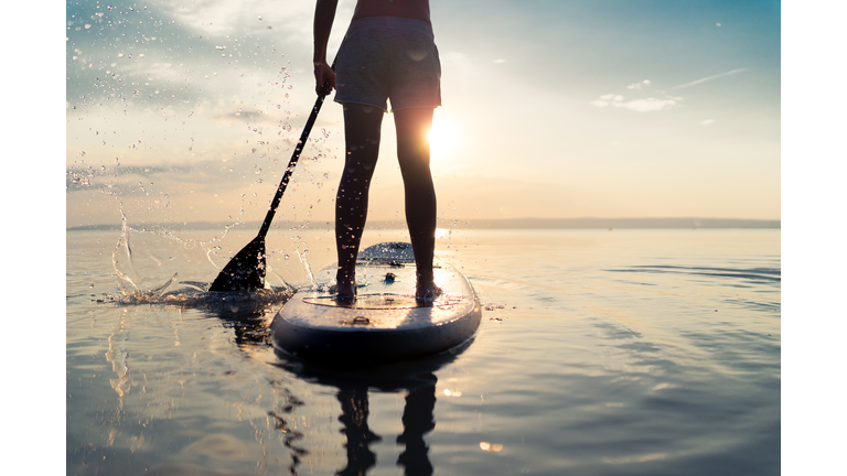 summer sunset lake paddleboarding detail