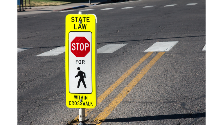 State law Stop for Pedestrians sign