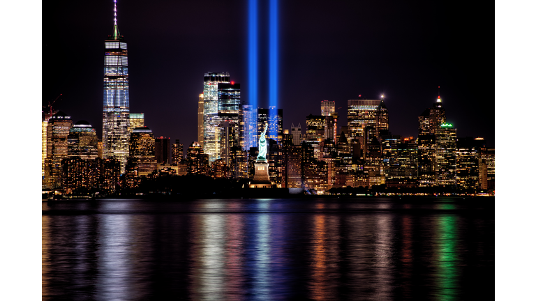 9/11 Memorial Beams with Statue of Liberty and Lower Manhattan