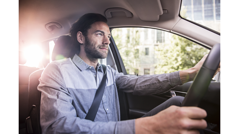 Businessman driving his car