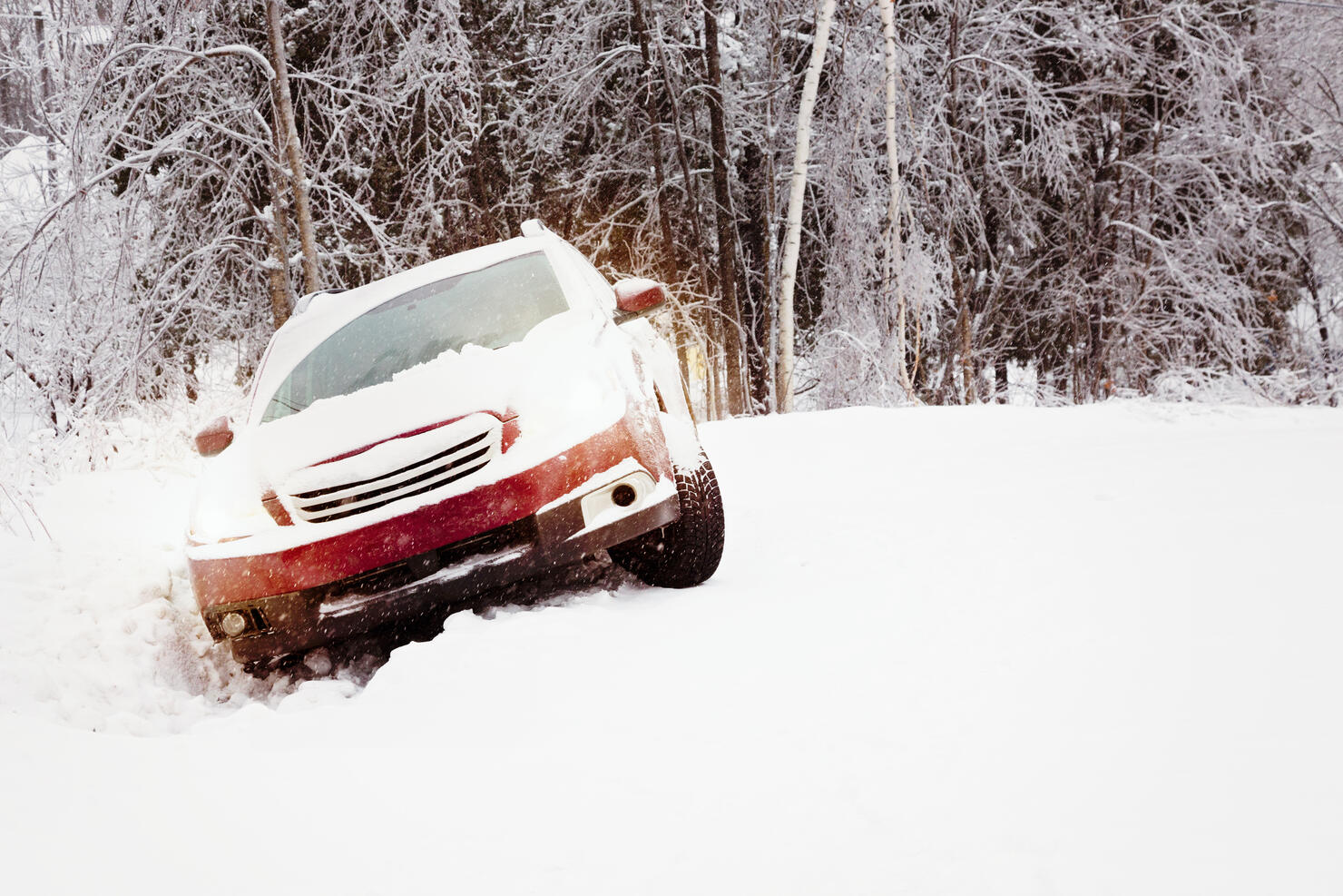 Winter snow accident car in a ditch