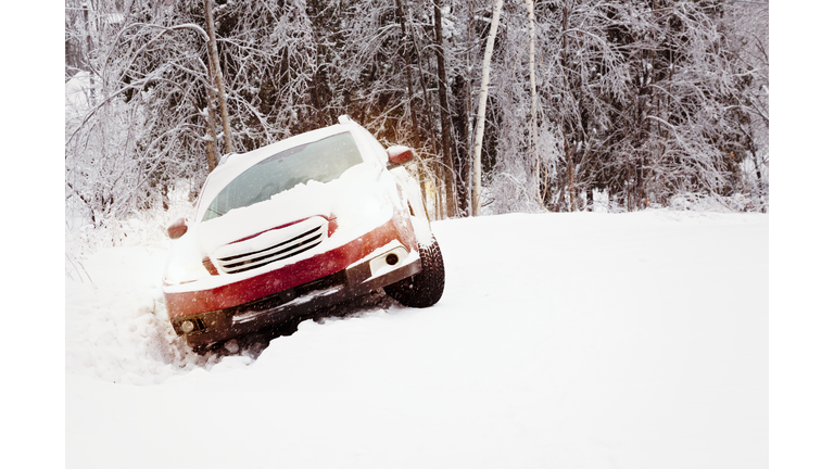 Winter snow accident car in a ditch