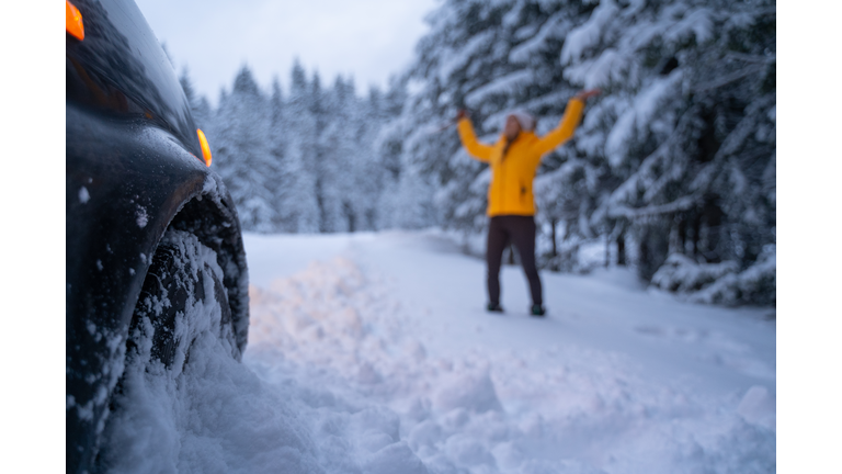 Cleaning the car and sweeping after the first snow. Emergency lights. Car issues in the middle of nowhere in bad weather. Car insurance. One woman on the road.