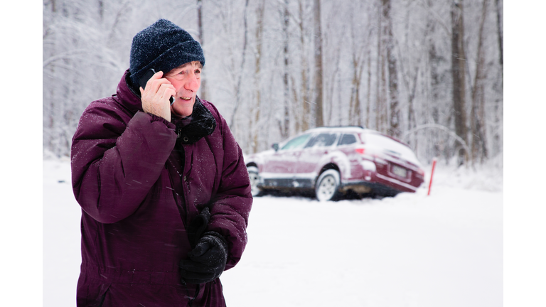 Senior man calling for help during snow storm