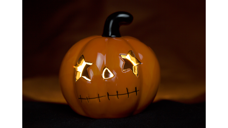 Close-up of Halloween pumpkin with a candle inside