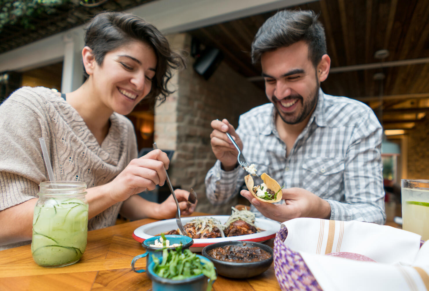 Happy couple eating at a restaurant