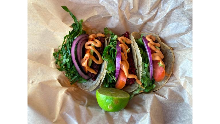 Vegetarian tacos served with chilli mayonnaise and fresh lime