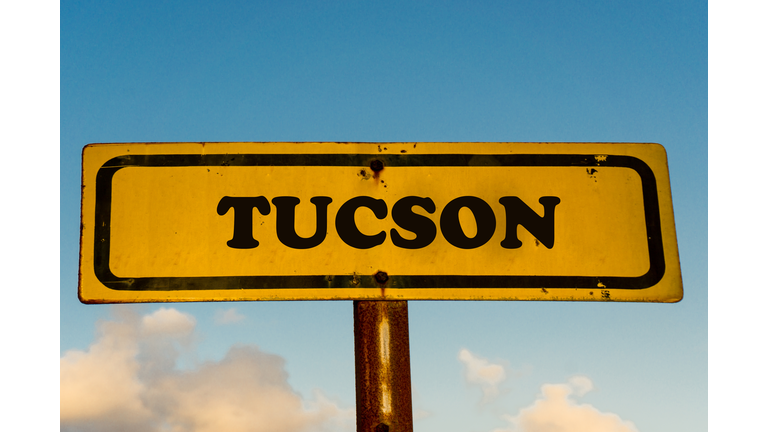 Tucson city street old antique yellow sign with blue sky at background, USA signal city series.