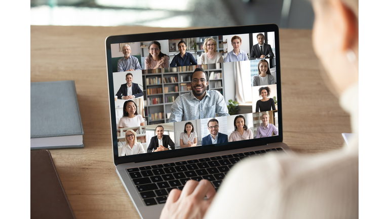 Female employee talk on video call with colleagues