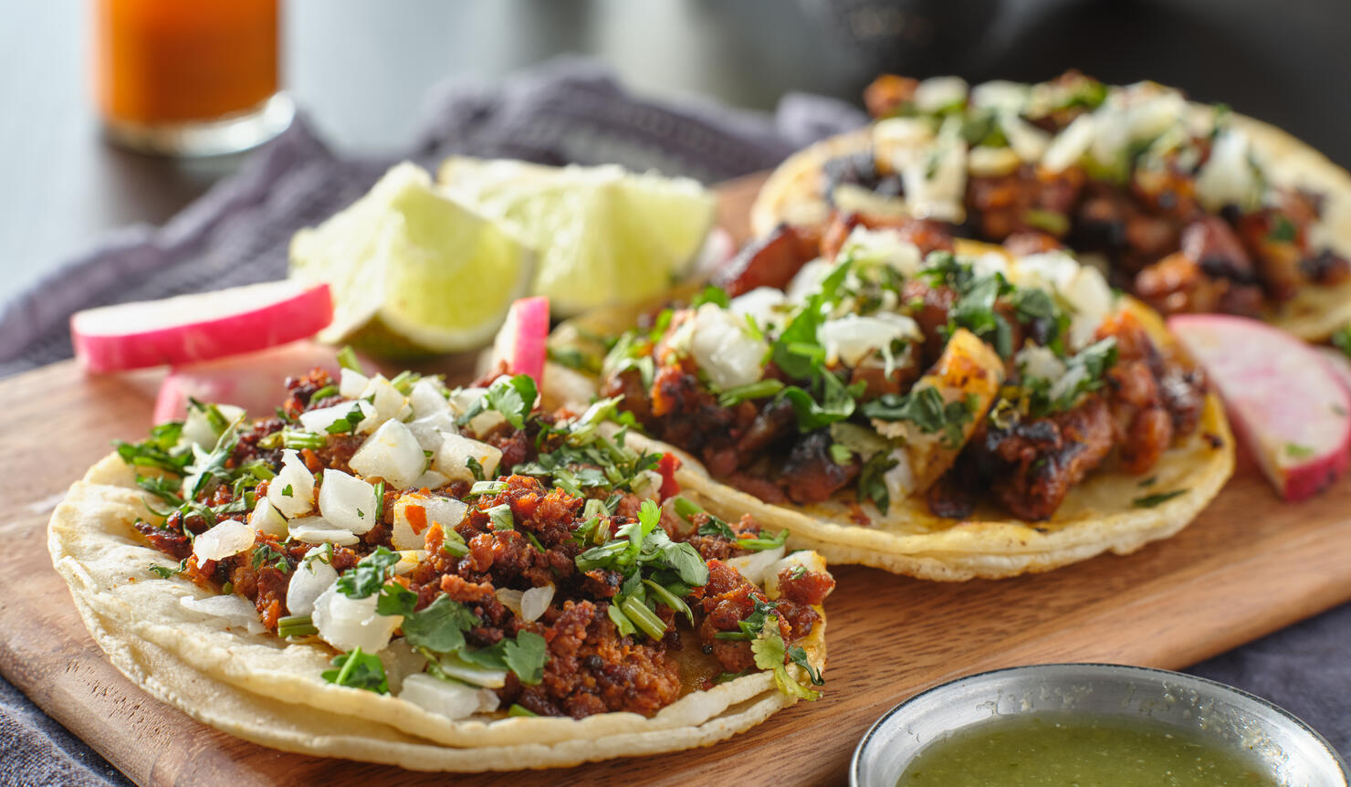 mexican street tacos with carne asada on corn tortillas platter