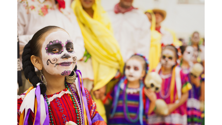 Hispanic children celebrating Dia de los Muertos