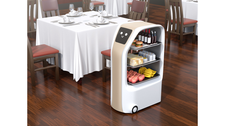 Food delivery robot stopped near a table waiting for picking meals in a restaurant